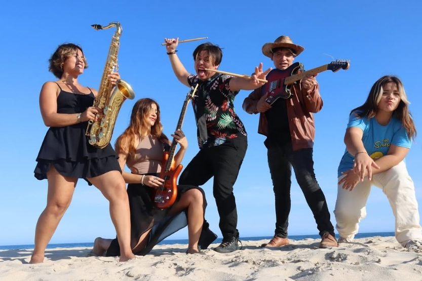 Kids Monsters full band at a beach party in Cabo Mexico